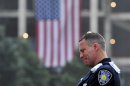 Daniel Henry, a Port Authority of New York/New Jersey police officer, pauses during a moment of silence during ceremonies marking the 12th anniversary of the 9/11 attack in New York