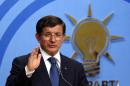 Turkish Prime Minister and leader of the Justice and Development Party Ahmet Davutoglu speaks during a press conference at the party headquarters in Ankara on August 17, 2015