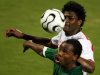 Zambia's Collins Mbesuma (bottom) is challenged by Tunisia's Radhi Jaidi during their African Nation..