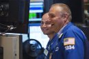 Traders laugh as they work on the floor of the New York Stock Exchange as it closes for the week, July 5, 2013. REUTERS/Lucas Jackson
