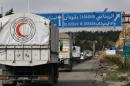 A convoy of aid from the Syrian Arab Red Crescent heads to the besieged rebel-held Syrian town of Madaya, on January 14, 2016
