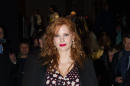 Actress Jessica Chastain poses as she leaves Yves Saint Laurent's ready to wear fall-winter 2015-2016 fashion collection during Paris fashion week, Paris, Monday, March 9, 2015. (AP Photo/Zacharie Scheurer)