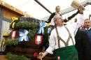 Munich Mayor Ude taps first barrel of beer during opening ceremony for 180th Oktoberfest in Munich