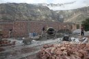 Men build a new madrassa, a religious school, in the village of Gimry