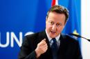 British Prime Minister David Cameron holds a press conference in Brussels on December 17, 2015