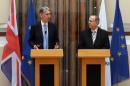 British Foreign Secretary Philip Hammond, left, and Cypriot Foreign Minister Ioannis Kasoulides speaks to the media after their meeting at the Foreign Ministry in Nicosia, Cyprus, July 17, 2015. Hammond said Britain is 