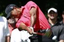 Tiger Woods of the U.S. hits his tee shot on the second tee during the final round of the PGA Championship golf tournament in Carmel, Indiana