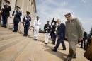 Defense Secretary Chuck Hagel welcomes Qatari Defense Minister Hamad bin Ali al-Attiyah, right, to the Pentagon, Monday, July 14, 2014, during an honor cordon. (AP Photo/Manuel Balce Ceneta)