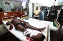 A man, injured in a suspected grenade attack, lies on a hospital bed as he receives treatment at the Coast General Hospital in Mombasa