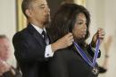 President Barack Obama awards Oprah Winfrey the Presidential Medal of Freedom, Wednesday, Nov. 20, 2013, in the East Room of the White House in Washington. (AP Photo/Pablo Martinez Monsivais)