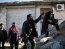 Free Syrian Army fighters take their position during a fight with forces loyal to Syrian President Bashar al-Assad at the front line in Aleppo