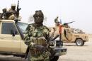 Chadian soldier poses for picture at front line during battle against insurgent group Boko Haram in Gambaru