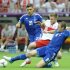 Greece's Katsouranis and Papadopoulos challenge Poland's Blaszczykowski during Euro 2012 soccer match in Warsaw