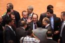 Iraqi Prime Minister Nouri al-Maliki, center, greets lawmakers at the first session of the newly elected parliament in the heavily fortified Green Zone in Baghdad, Iraq, Tuesday, July 1, 2014. Iraq's new parliament ended its inaugural session Tuesday after failing to make any progress in choosing a new prime minister even as the country faces a militant blitz that threatens to rip it apart and a spike in violence that made June the deadliest month in at least two years. (AP Photo/Hadi Mizban)