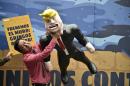 A Mexican protests against US Republican presidential candidate Donald Trump in front of a specially made scenery wall during an AVAAZ-organized rally at the Angel of Independence Square in Mexico City on September 25, 2016