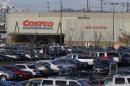 In this Tuesday, Nov. 24, 2015, file photo, cars fill the parking lot of a Costco store in Seattle. A California farm is recalling a vegetable mix believed to be the source of E.coli in Costco chicken salad that has been linked to an outbreak that has sickened several people in multiple states, the Food and Drug Administration said Thursday, Nov. 26. (AP Photo/Ted S. Warren, File)