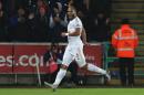 Swansea City's defender Ashley Williams celebrates scoring during an English Premier League football match against Watford at The Liberty Stadium in Swansea, south Wales on January 18, 2016