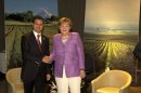 Mexico's President Pena Nieto shakes hands with Germany's Chancellor Merkel during a private meeting at summit of the CELAC-UE in Santiago