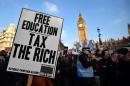 Students protest outside the Houses of Parliament during a march against university fees in London on November 19, 2014