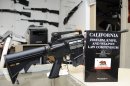 A 736-page California gun law book is on display along with guns at Aegis Trading Enterprises gun shop in Burbank California