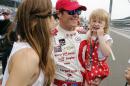 Scott Dixon, center, of New Zealand, celebrates with wife Emma, left, and daughter Tilly, 3, after qualifying on the pole for the Indianapolis 500 auto race at Indianapolis Motor Speedway in Indianapolis, Sunday, May 17, 2015. (AP Photo/Sam Riche)