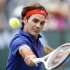 Roger Federer of Switzerland returns a shot against Denis Istomin of Uzbekistan during their match at the BNP Paribas Open ATP tennis tournament in Indian Wells