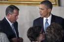 U.S. President Barack Obama talks with Speaker of the House John Boehner (R-OH) at the conclusion of the Inaugural luncheon in Statuary Hall after his ceremonial swearing in at the U.S. Capitol on Capitol Hill in Washington
