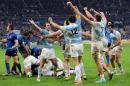 Argentina's rugby team players celebrate after winning their test international rugby match against France at the Stade de France stadium in Saint Denis, outside Paris, Saturday Nov. 22, 2014. Argentina won 18-13. (AP Photo/Remy de la Mauviniere)