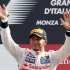McLaren Formula One driver Hamilton of Britain waves as he celebrates on the podium after winning the Italian F1 Grand Prix at the Monza circuit