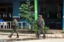 Soldiers walk down a street of La Macarena, Meta department, Colombia, on February 23, 2016
