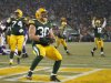 Green Bay Packers fullback John Kuhn celebrates after scoring a touchdown during the first half of an NFL wild card playoff football game against the Minnesota Vikings Saturday, Jan. 5, 2013, in Green Bay, Wis. (AP Photo/Mike Roemer)