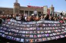 People hold a banner in tribute of the victims of last year's bombings in Ankara on March 10, 2016