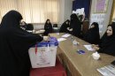 An Iranian woman casts her ballot for the parliamentary runoff elections, in a polling station, in Tehran, Iran, Friday, May 4, 2012. The country has begun runoff elections for more than one-fifth of parliamentary seats. Friday's report says 130 hopefuls will compete for 65 seats in 33 constituencies including the capital Tehran with 25 undecided seats. (AP Photo/Vahid Salemi)