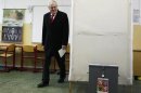 Presidential candidate and former Prime Minister Milos Zeman walks to cast his vote during the second round of the first ever direct Czech presidential election in Prague