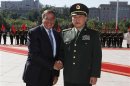 U.S. Secretary of Defense Panetta shakes hands with China's Defense Minister Liang before a ceremony at the Bayi Building in Beijing