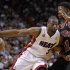 Miami Heat's Dwyane Wade drives against Chicago Bulls' Jimmy Butler in the first half of their NBA basketball game in Miami, Florida