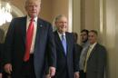 U.S. President-elect Donald Trump walks with Senate Majority Leader McConnell on Capitol Hill in Washington
