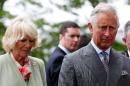 Britain's Prince Charles, Prince of Wales (R) and Camilla, Duchess of Cornwall (L) after a service of peace and reconciliation at St Columba's Church in Drumcliffe, Ireland, on May 20, 2015