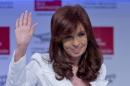 Argentina's President Cristina Fernandez greets the public after she arrives at the Argentine Chamber of Construction annual convention in Buenos Aires, Argentina, Tuesday, Nov. 25, 2014. Fernandez appeared for the first time in public after more than 20 days, after recovering of a bacterial infection. (AP Photo/Natacha Pisarenko)