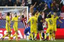 Players of Rostov argue with referee Craig Thompson after Atletico scored second goal during the Champions League Group D soccer match between Atletico Madrid and Rostov at the Vicente Calderon stadium in Madrid, Spain, Tuesday Nov. 1, 2016. (AP Photo/Daniel Ochoa de Olza)