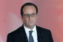 French President Francois Hollande poses prior to a debate on national television in Paris, France, Thursday, April 14, 2016. French President Francois Hollande answers questions on national television from members of the public, as the unpopular president faces labor protests and questions about whether he'll run for re-election. (Stephane de Sakutin, Pool Photo via AP)