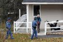 A worker from the Centers for Disease Control leaves the home of nurse Kaci Hickox after a brief visit, Thursday, Oct. 30, 2014, in Fort Kent, Maine. State officials are going to court to keep Hickox in quarantine for the remainder of the 21-day incubation period for Ebola that ends on Nov. 10. Police are monitoring her, but can't detain her without a court order signed by a judge. (AP Photo/Robert F. Bukaty)