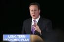 Britain's Prime Minister David Cameron delivers a speech to business leaders at a conference in the Old Granada TV Studios in Manchester