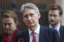 Britain's Foreign Secretary Philip Hammond leaves Downing Street after a meeting in London