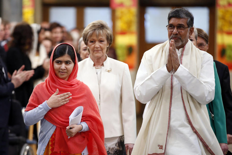 Nobel Peace Prize winners Malala Yousafzai from Pakistan, left, and Kailash Satyarthi of India arrive for the Nobel Peace Prize award ceremony in Oslo...
