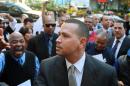New York Yankees' Alex Rodriguez arrives at the offices of Major League Baseball, Tuesday, Oct. 1, 2013 in New York. The grievance to overturn Rodriguez's 211-game suspension began Monday before arbitrator Fredric Horowitz. (AP Photo/David Karp)