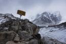 A sign shows the way to Everest Base Camp high in the Khumbu Glacier, one day after an earthquake-triggered avalanche swept through parts of the base camp killing scores of people, on April 26, 2015