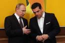 Greek Prime Minister Alexis Tsipras (R) talks with Russian President Vladimir Putin during their meeting in Athens on May 27, 2016