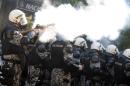 Police fire tear gas to disperse protesters during a gay pride parade in Podgorica on October 20, 2013