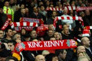 Liverpool supporters hold scarves heralding manager Kenny Dalglish at Anfield in 2011. Liverpool legend Dalglish was sacked as manager of the club on Wednesday in a dramatic move by the club's owners following a disappointing Premier League campaign. (AFP Photo/Paul Ellis)